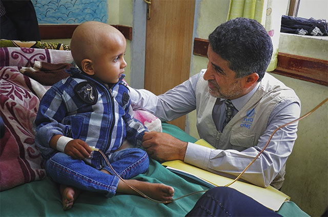 Dr Ahmed Al-Mandhari with Yemeni Kid