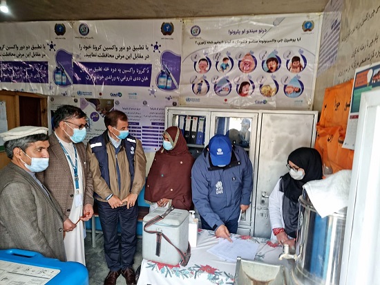 4-WHO-Rep-Dr-Luo-Dapeng-discussing-measles-vaccination-coverage-in-Wardak