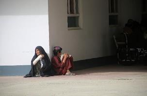 Babu waits for a check-up outside the Emergency Surgical Centre in Lashkar Gah