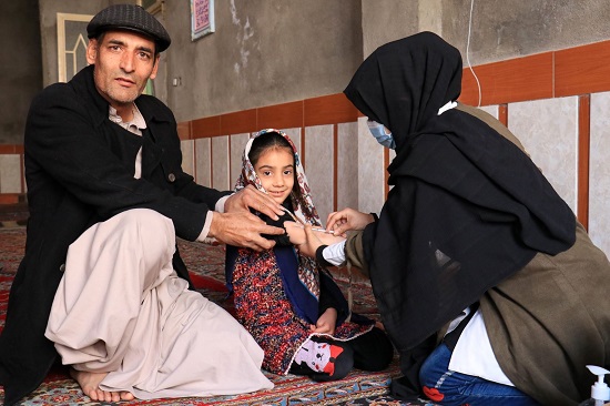 child-receives-measles-polio-vaccine