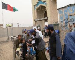 Children are vaccinated against polio at the Spinboldak border crossing between Afghanistan and Pakistan