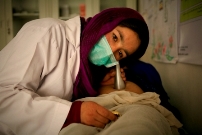 Community_midwife_from_Bamyan_province__listens_to_a_babys_heartbeat_Photo_Rada_Akbar_UNFPA_Afghansitan