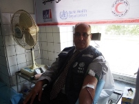 WHO's Health Cluster Coordinator Dr Abou Zeid donating blood at the World Blood Donor Day event in Kabul