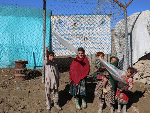 Credit: WHO Afghanistan/S.Ramo Children stand in front of the WHO-supported mobile clinic at the Nasaji Bagrami camp for internally displaced persons in Kabul. The Nasaji Bagrami camp is home to over 700 families – almost 1000 children under 5 – most of whom have fled ongoing violence and conflict in their provinces. Around 60% of the 103 000 Afghans displaced due to conflict in 2017 are children.