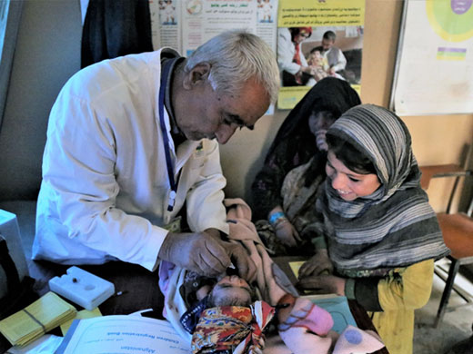 Credit: WHO Afghanistan/S.Ramo Abdurrahman is only one day old and he is receiving the oral polio vaccine (OPV) at the Charahi Qambar IDP camp’s mobile clinic. These clinics provide children with life-saving vaccinations against serious diseases such as polio and measles and also provide tetanus vaccines for women.