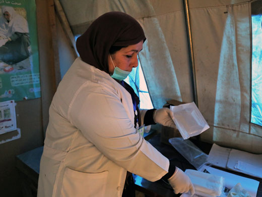 Credit: WHO Afghanistan/S.Ramo Midwife Khadija displays the content of a clean delivery kit, a small pack that contains a bar of soap, plastic sheet, a razor blade and a piece of clean string. Many women in the camps give birth at home in basic conditions and midwives from the mobile clinics often assist with these deliveries. However, if there is no midwife in the camp, midwives give families clean delivery kits and teach them how to use them so they can have a safer birth at home. WHO has distributed 200 of these kits to Kabul mobile clinics in the past 4 months.