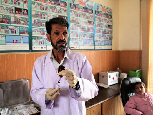 Said Ghazanfar prepares a sodium stibogluconate injection at a Kabul leishmaniasis treatment centre where he has worked for the past 30 years. Leishmaniasis generally affects the poor and is associated with malnutrition, population displacement, poor housing and a weak immune system. Sandflies that spread the disease are often found in crowded areas with poor sanitation. Due to increasing population density, movements, displacement, crowded and poor living conditions in urban areas, more people are at risk of contracting leishmaniasis.