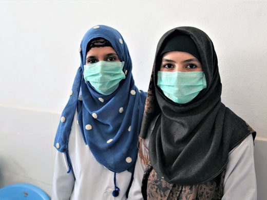 Credit: WHO Afghanistan/S.Ramo Fatima (left) and Farahnaz have been working in the Kunduz trauma unit for the past 6 months. They both received diplomas from the Ghazanfar Medical Institute in Kunduz in 2015. Fatima and Farahnaz dream of becoming specialized medical doctors but there are no opportunities for further study in their province. “The most interesting part of my job is to see the patients happy when we care for them,” said Fatima.