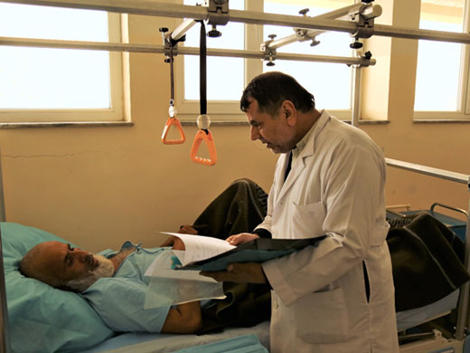 Credit: WHO Afghanistan/S.Ramo Head nurse Abdul Malik checks on 50-year-old Abdul Ahmad who fractured his knee a few days ago. “I’m very happy for the treatment I have received here, the doctors visit me many times a day,” Abdul Ahmad says. He has 6 children and he works as a shopkeeper in a village in south-eastern Kunduz. Nurse Malik has worked in different Kunduz hospitals for over 29 years. “The trauma care unit has been helpful in terms of decreasing the patient load of the main hospital and making sure we can give more timely treatment for everyone who is in need,” Mr Malik said.