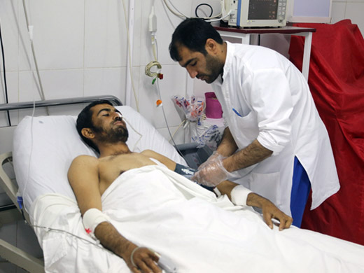 Credit: WHO Afghanistan/G.Elham Mohammad Taous, head of the nursing department, checks on a patient. He has worked at the Emergency hospital in Lashkar Gah for 10 years. “The number of patients we get really depends on the security situation on the ground. But over the years, I have seen an increase in the average numbers of patients as the security situation is getting worse and worse,” Mohammad says.