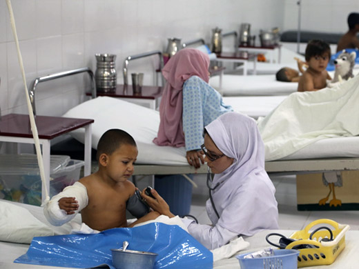 Credit: WHO Afghanistan/G.Elham Nurse Zahra checks the blood pressure of a child at the Emergency hospital. “Life is very difficult in Helmand, we always live in fear and my family even cannot sleep properly at nights. Sometimes there are many victims who come into this hospital, and we all feel very tired by the end of the day. But we do this work to save Afghan lives,” says Zahra.