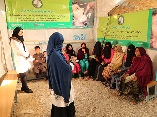 Photo credit: WHO Afghanistan/S.RamoPolio social mobilizers talk to women who have just arrived from Haripur, Pakistan, about the different kinds of vaccinations children need and the benefits of immunization. Polio workers at this UNHCR encashment centre in Kabul, where refugees come to register and collect their cash allowance, say that very few families have refused the polio vaccine. “Some families have been suspicious of the side effects of the vaccine, but after we explain that the vaccine is completely safe, that it has no side effects and it is essential to make sure our children stay healthy, they accepted it and we could vaccinate their children,” said one of the vaccinators. During the interactive education session, social mobilizers ask all women to ensure their children are vaccinated during regular house-to-house polio immunization campaigns. They also describe to them the symptoms of acute flaccid paralysis (AFP), an indicator for polio, asking the women to bring their children to the nearest health centre if they suffer from any floppy weakness of the limbs.