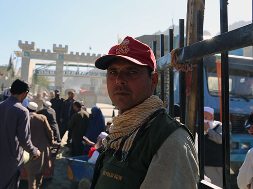 Photo credit: WHO Afghanistan/S.RamoSardar has been a polio vaccinator for 5 years. “We vaccinate hundreds of children every day by giving them 2 drops of the oral polio vaccine. We often climb into the trucks as they cross the border if the children don’t come down. This way we know we reach all children,” said Sardar, one of the vaccinators immunizing children at the Torkham border crossing in eastern Nangarhar province. “I want to help our children. Our country needs to finish polio for good.”