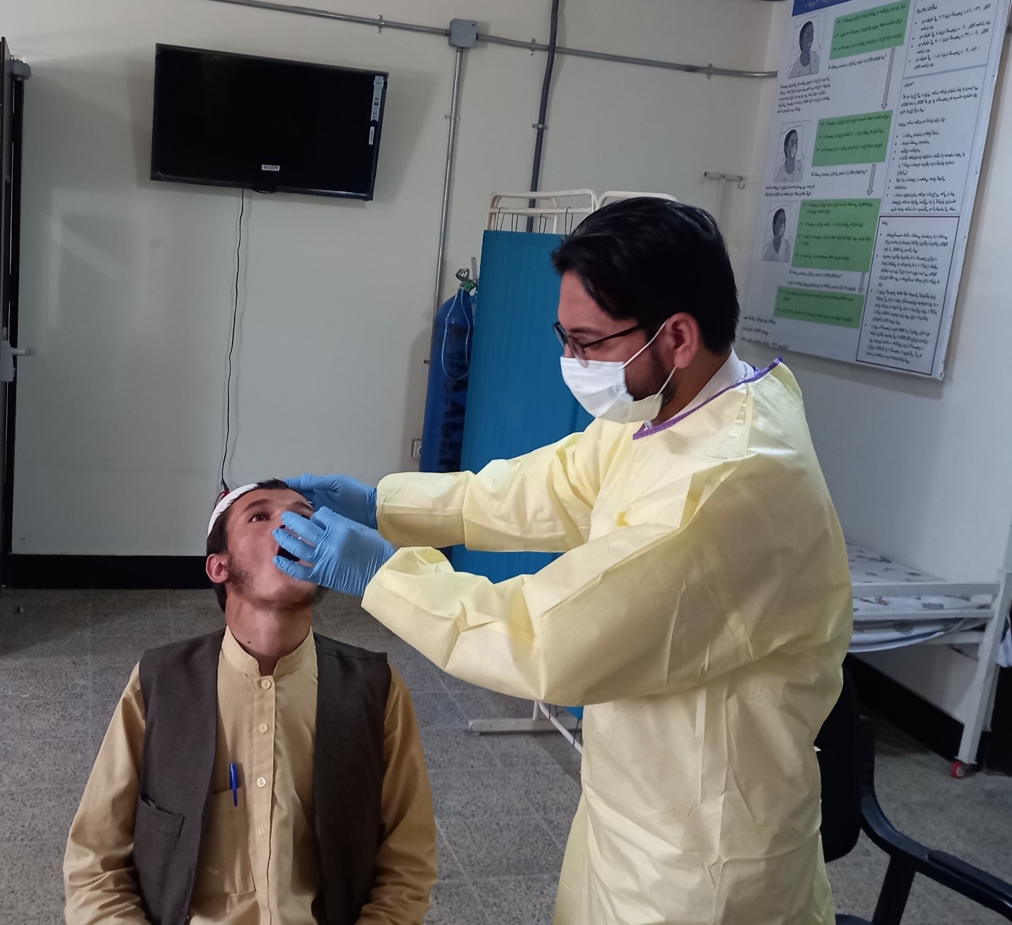 giving-sample-for-COVID-19-testing-at-the-confirmatory-laboratory-in-Kunduz-province