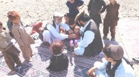 A refugee child from Pakistan's North Waziristan gets a medical check in Khost province