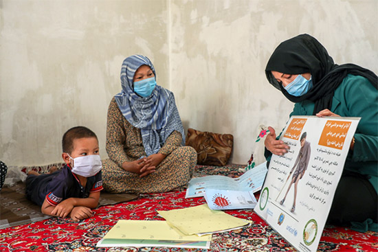 Besides her work on COVID-19 response, Nasrin teaches women in her community about symptoms of polio and how it can be prevented. Credit: WHO Afghanistan/Roya Haidari