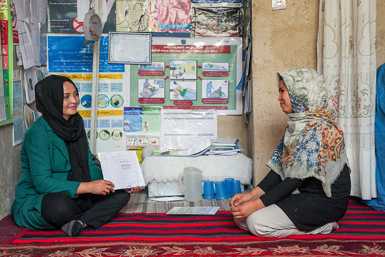 Nasrin takes a leading role sharing health information with local women through her role as a District Polio Officer and midwife. Alongside thousands of her colleagues, she has devoted the last seven months to mitigating the effects of COVID-19. Credit: WHO Afghanistan/Roya Haidari