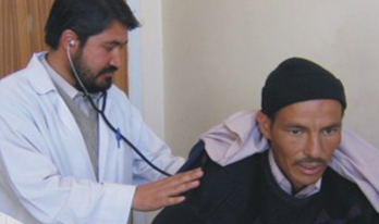 Doctor listening to a tuberculosis patient’s lungs