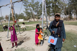 Wajid vaccinates children at a Kandahar park during a Friday “re-visit” campaign day