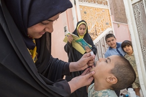 A child receives the oral polio vaccine. Photo: WHO/G.Elham