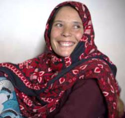 Tahira_waits_for_her_medical_check_at_a_WHO-supported_mobile_clinic_in_Bamyan_province