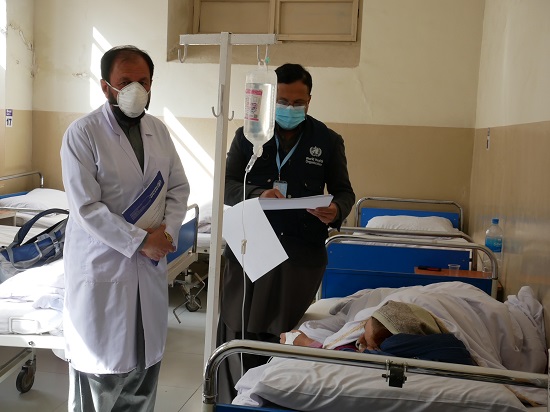 two-afghan-doctors-treat-patient