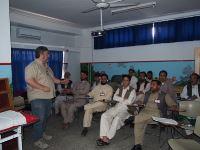 Emergency NGO's trainer Dr Paul Ley discusses wound classification with surgeons at the Emergency Hospital in Kabul