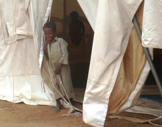 Boy in Yemen at entrance to tent