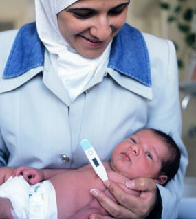 Nurse holding baby