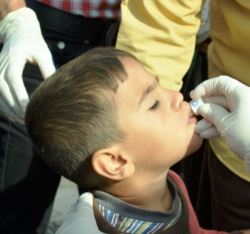 Boy_receives_oral_cholera_vaccine