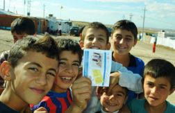 Boys_holding_a_leaflet_on_cholera_during_the_cholera_campaign_in_Iraq