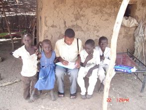 A surveillance officer collecting information from a group of children