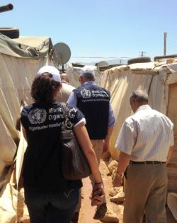 WHO staff members at a refugee camp