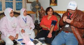 A woman's blood pressure is monitored in the presence of two nurses