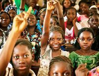 African girls hold up their hands in support of International Womens Day