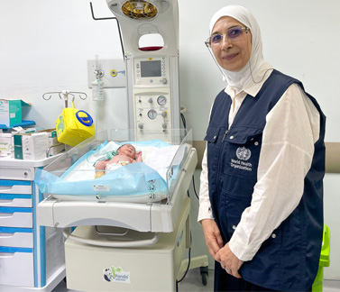 WHO health officer visiting a newborn care unit to ensure quality neonatal services and support for newborn health