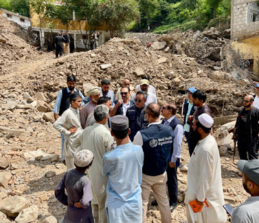 WHO Representative and teams during a visit with provincial authorities to evaluate the impact of a recent cloudburst in Dalori Bala village, Swabi District, in Khyber Pakhtunkhwa