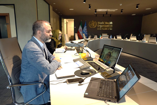 Dr Rahim Taghizadeh, Head of the Healthier Population Unit, and his team, sit at the first round of the workshops in the WHO country office. Photo: WHO/Islamic Republic of Iran