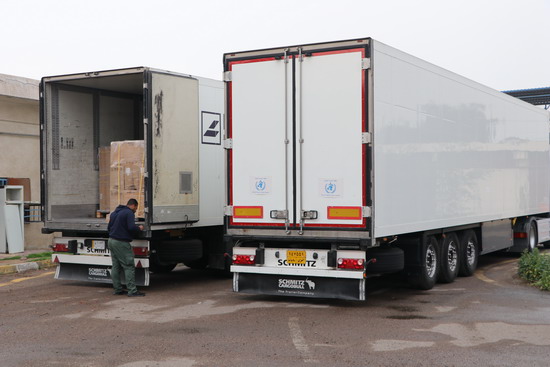 2_big_trucks_loaded_with_medical_supplies_provided_by_the_World_Health_Organization_to_MOH