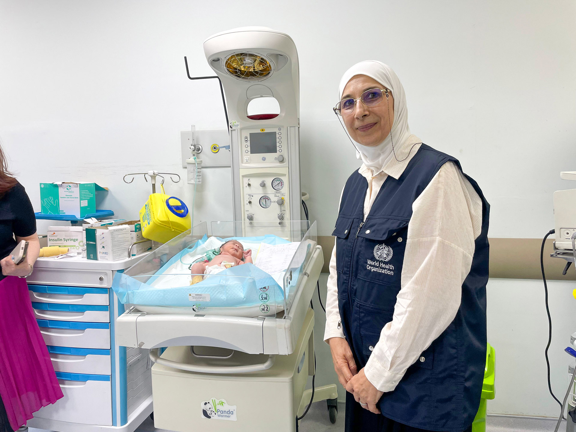WHO health officer visiting a newborn care unit to ensure quality neonatal services and support for newborn health
