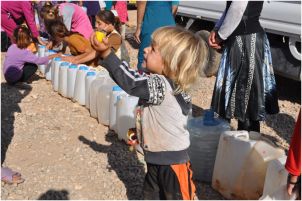 Boy_waits_for_water