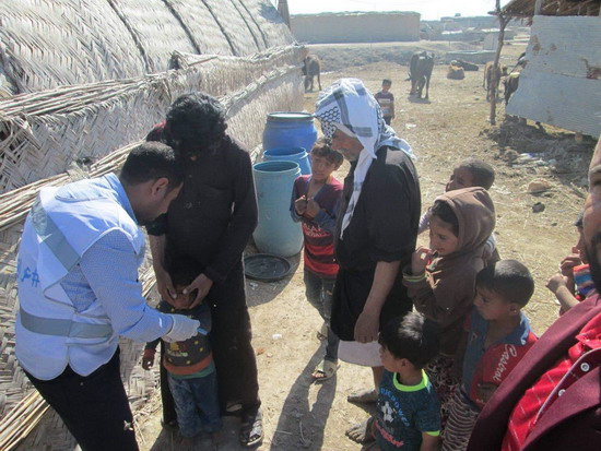 Children are vaccinated in a rural area in Basra