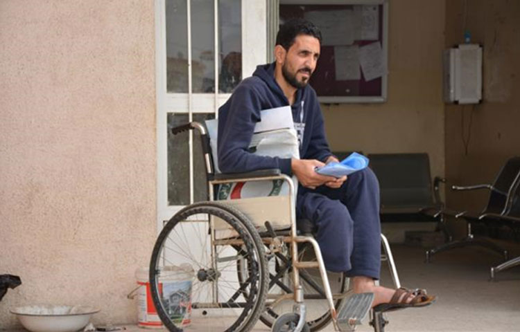 احد المعاقين يزور المركز التأهيلي في الموصل لتحديث التسجيل وإجراء الفحص الروتيني – الموصل - حزيران 2018