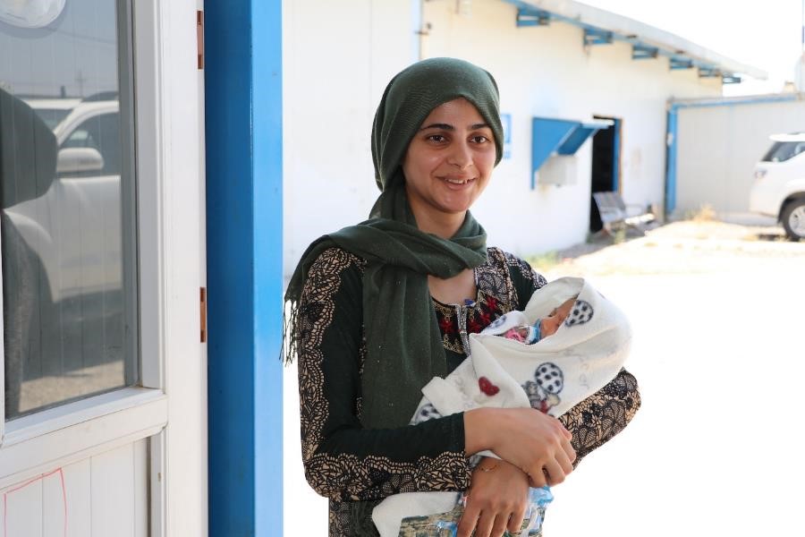 Hiba, a Syrian refugee visiting the PHCC in Darashakran camp to check her newborn baby