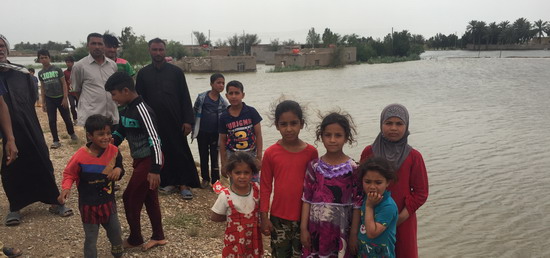 People displaced by the flood water in al-Btairah in Missan