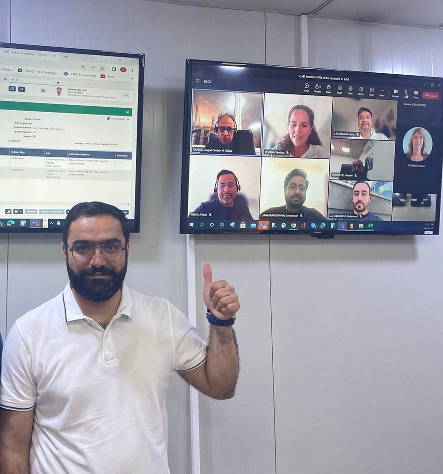 Photo: Diligent hands of the WHO Iraq Supply Chain Team: Mr. Ahmed Al-Ali in his office and Mr. Mahmoud Al Shakarjy online, positioned second row from the right on the screen.