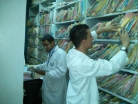 two health care workers collect data for the rapid health assessment.