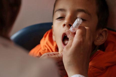 Child in Jerash receives vaccine in a health clinic