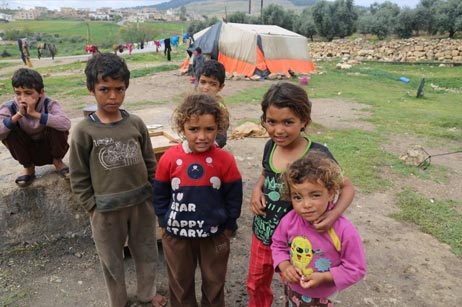 Children of a nomadic family in a high-risk area outside Jerash. Polio vaccinators reached the family’s under-5-year-old in the campaign. A mark on the boy’s ‘pinky’ finger, made with a semi-permanent marker, indicates that he was recently vaccinated