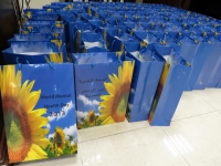 The sunflower on these complimentary gifts is the international symbol for World Mental Health Day.
